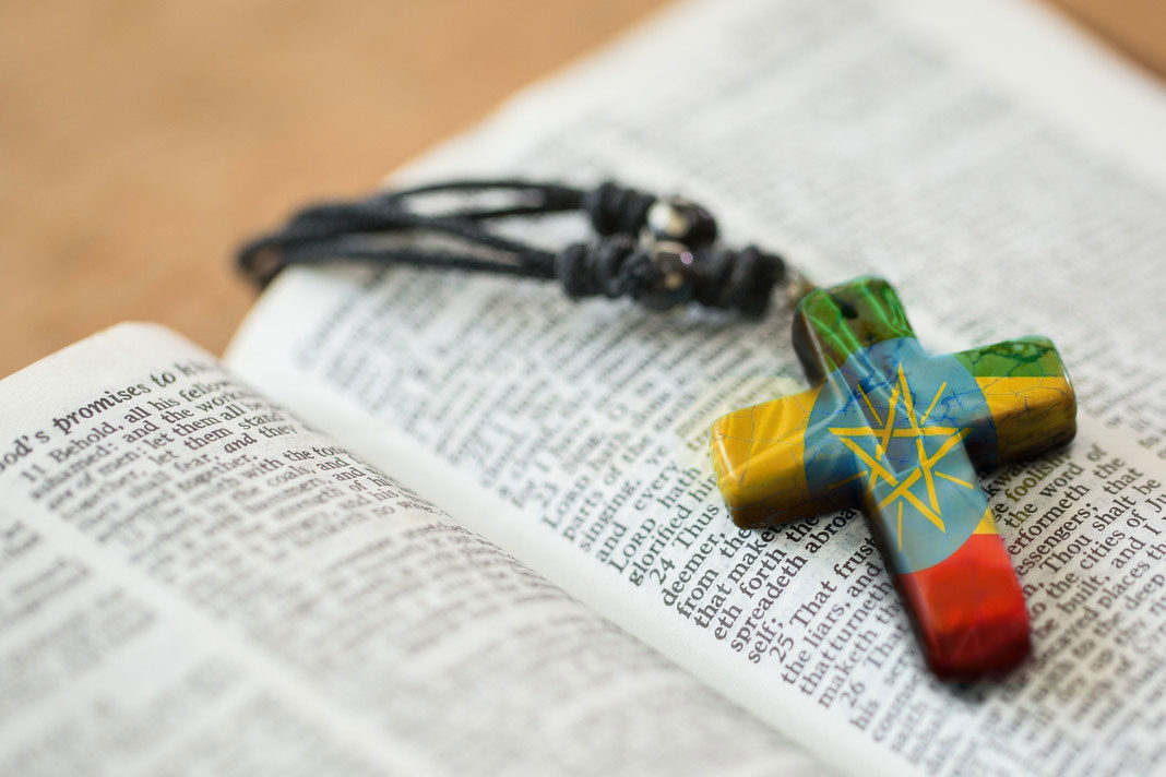 Bible and cross with Ethiopia Flag