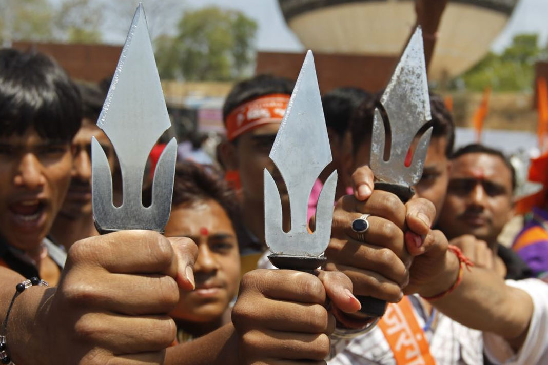 Supporters of hardline Vishwa Hindu Parishad Hindu group hold tridents in the western Indian city of Ahmedabad, India. | (PHOTO: REUTERS)