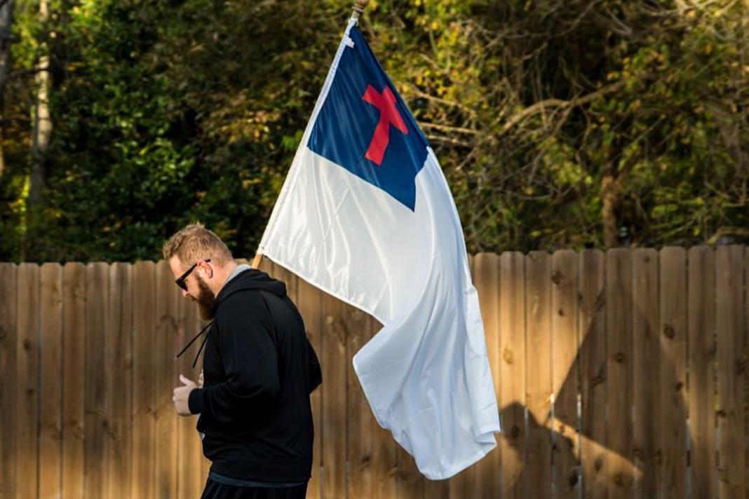 boston-bans-christian-flag-but-approves-284-other-ones Man jogging with Christian Flag