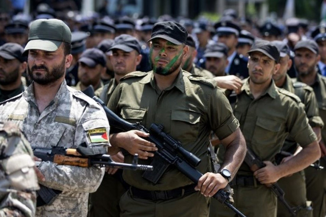 Illustrative: Members of Hamas's military branches take part in a military parade in Gaza City on July 26, 2017. (AFP Photo/Mahmud Hams)