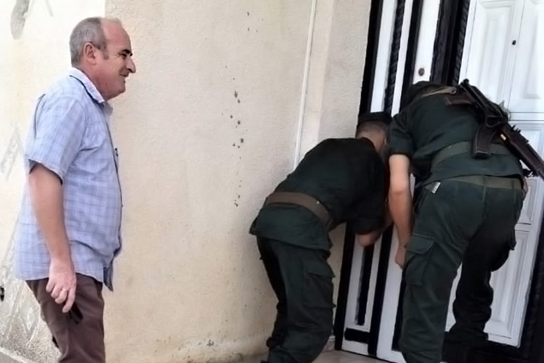 Pastor Messaoud Talkit watches as gendarmes seal church building in Lekhmis village Algeria on August 6, 2019. / Morning Star News