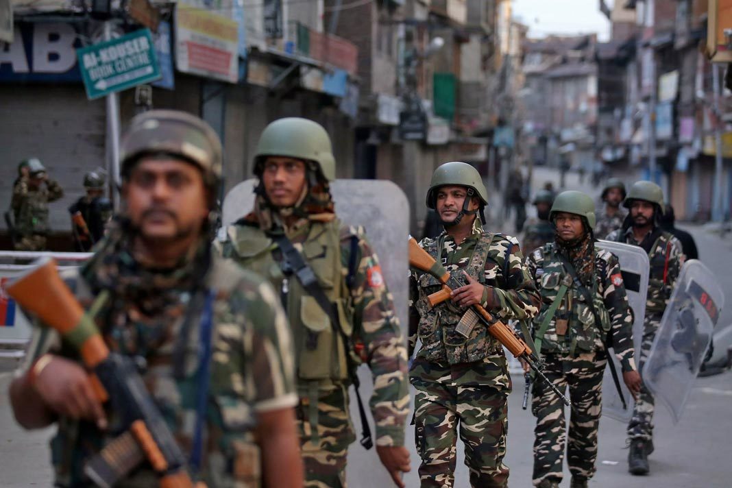 Indian security forces personnel patrol a deserted street during restrictions after the government scrapped special status for Kashmir, in Srinagar August 9, 2019. REUTERS/Danish Ismail