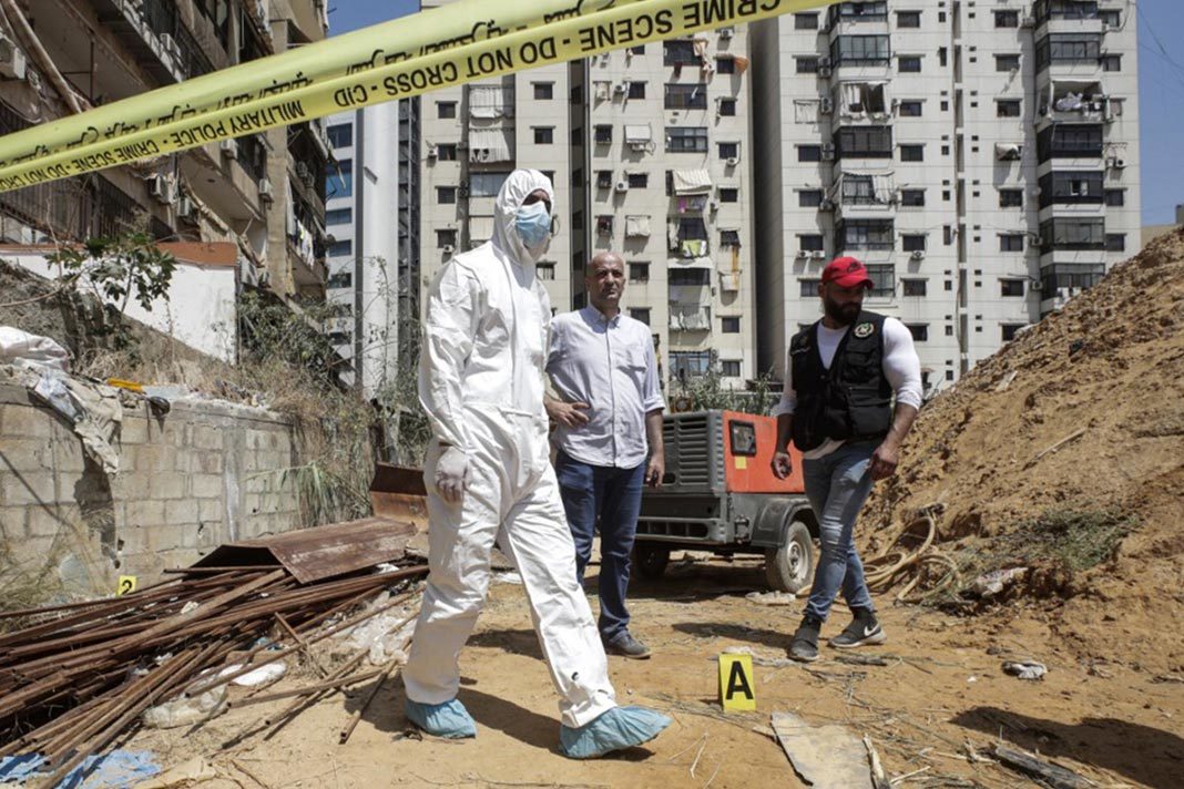 lebanese-president-says-alleged-israeli-strikes-a-declaration-of-war Lebanese military intelligence inspects the scene where two drones came down in the vicinity of a Hezbollah media center in the south of the capital Beirut, August 25, 2019. (Anwar Amro/AFP)