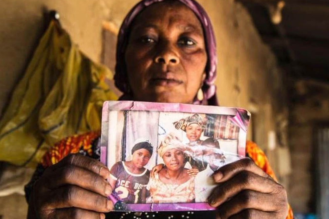 Nigerian-Government-Leah-Sharibu-Alive-Negotiations-Ongoing Leah Sharibu's Mother Rebecca Sharibu holds up her photo.