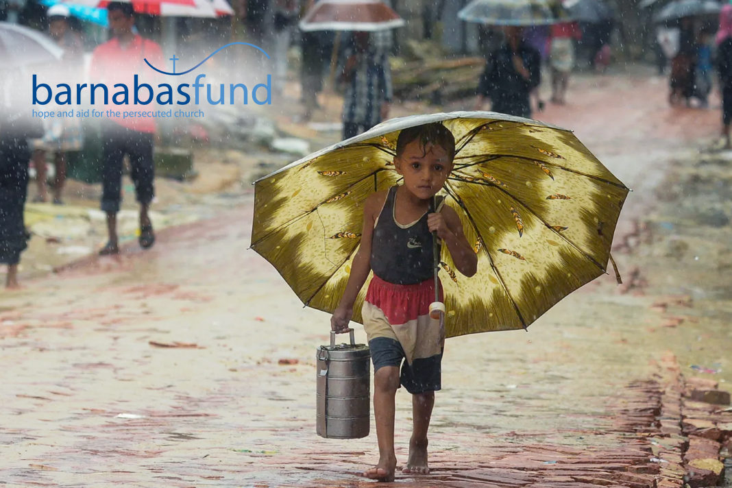 Child walking in the rain