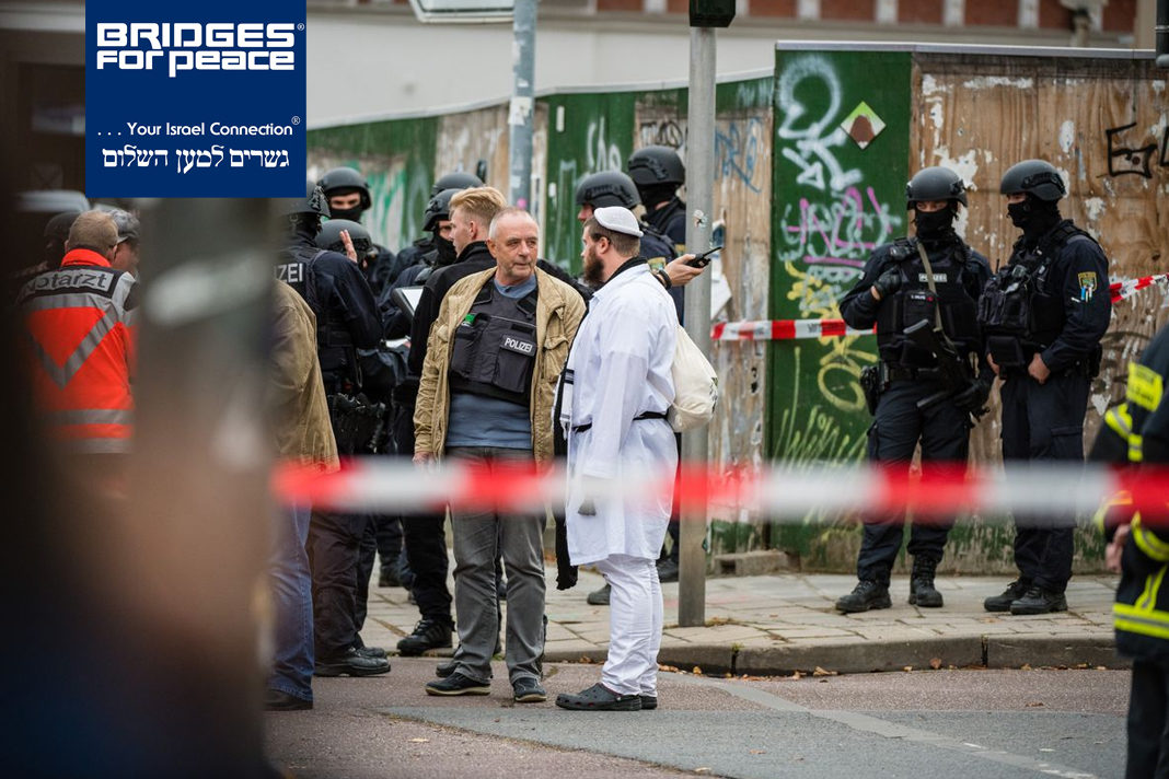 Jewish parishioners in traditional clothing and police forces stand near the scene of a shooting that left two people dead on Oct. 9, 2019, in Halle, Germany. (Jens Schlueter/Getty Images)