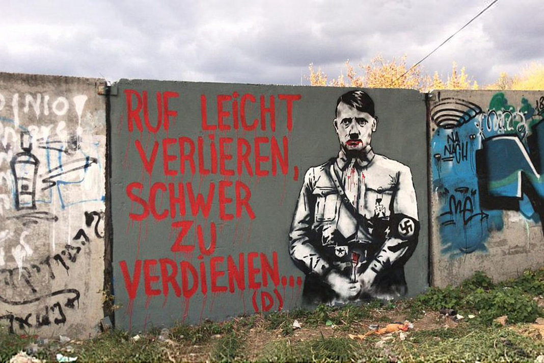 watch-portrait-of-adolf-hitler-painted-on-wall-near-grave-of-holy-rabbi-in-ukraine Portrait of Adolf Hitler Painted on Wall Near Grave of Holy Rabbi in Ukraine