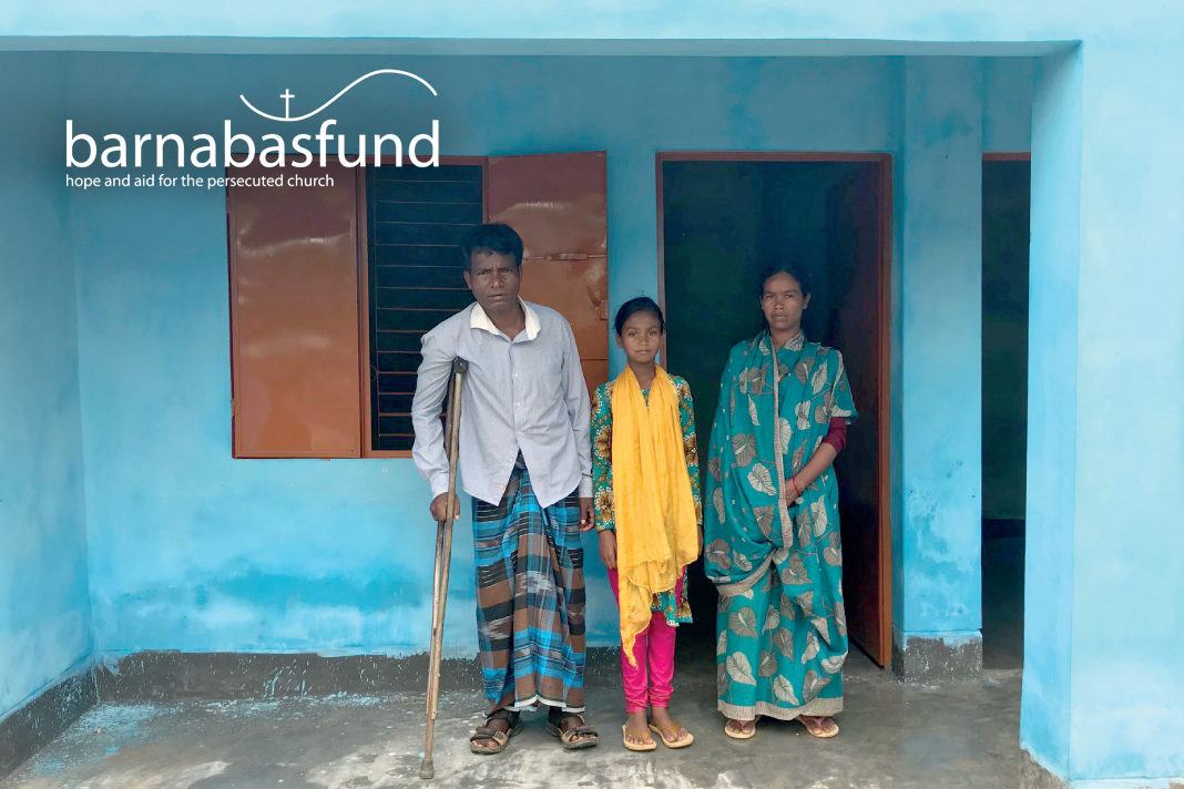 homeless-christians-in-india-praise-god-for-new-homes Hopan Murmu (pictured with his family), who was shot in the leg as he fled an attack by authorities on his community, is thankful to God for his new Barnabas-built home
