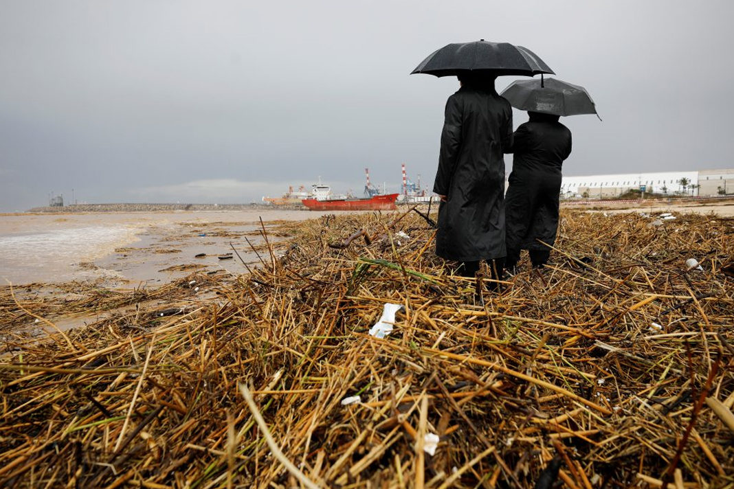 heavy-rainfall-in-northern-israel-breaks-50-year-record Men stand on washed-up river cane while gazing out at the Mediterranean Sea as heavy rain poured down, in Ashdod, Thursday 9 January 2020. (Reuters/Amir Cohen)