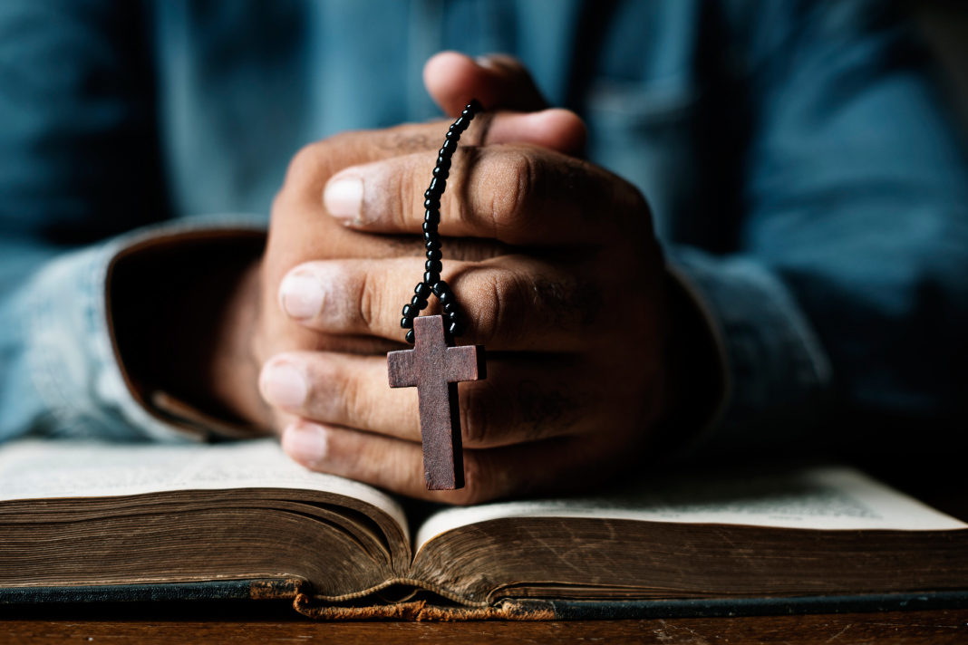 pastors-need-a-firm-biblical-foundation Hands with cross