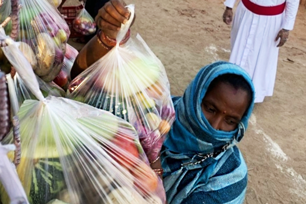 christians-rise-up-as-covid-19-pushes-families-to-brink-of-starvation Woman packing Food Courtesy of GFA