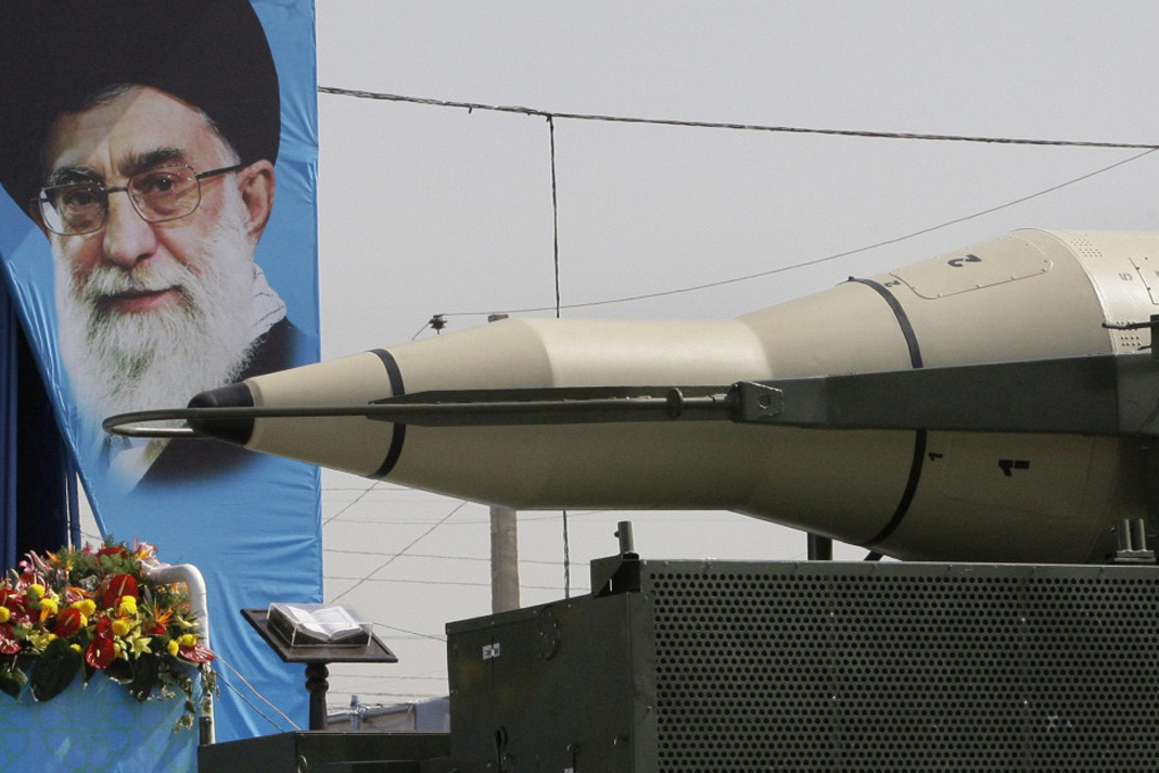 israel-fears-iran-may-develop-nuclear-bomb-as-world-focuses-on-corona A Sajjil missile is displayed by Iran's Revolutionary Guard, in front of a portrait of Iranian supreme leader Ayatollah Ali Khamenei, during a military parade, Sept. 21, 2012. (AP/Vahid Salemi)