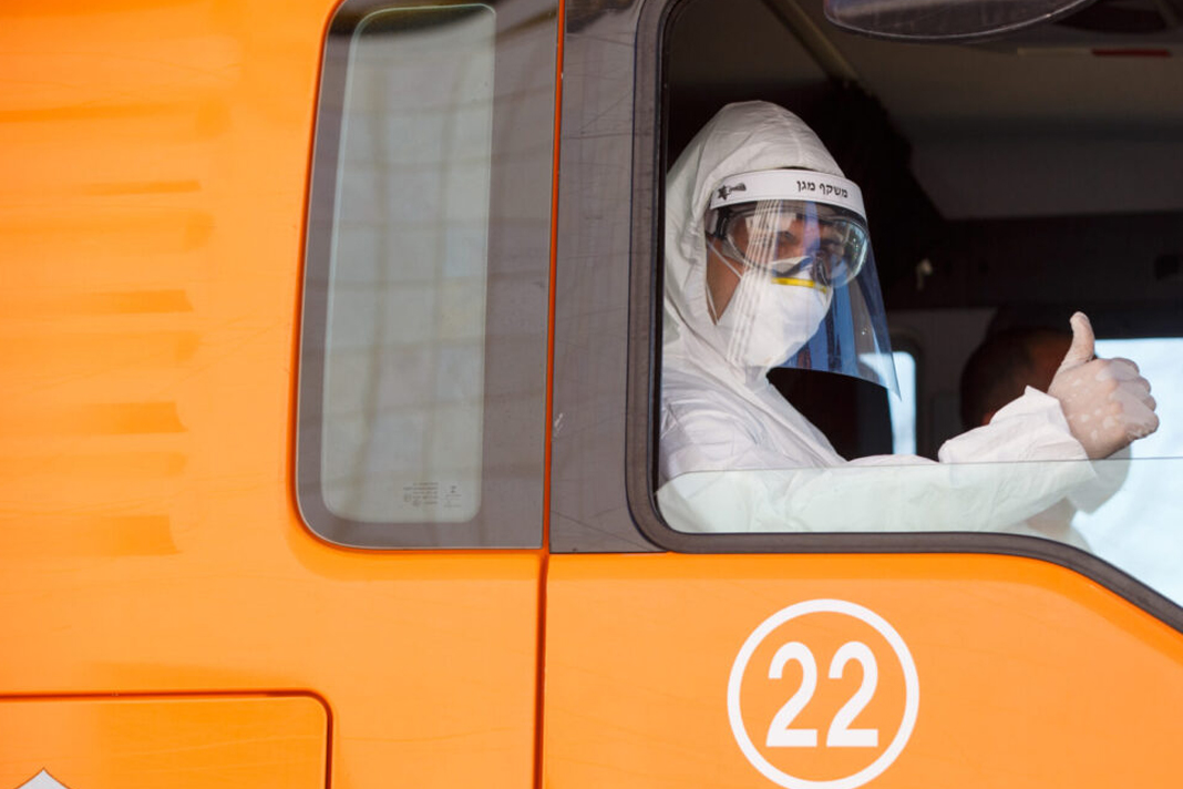 over-70-israeli-med-tech-firms-on-front-lines-of-covid-19-fight An Israeli firefighter joins in the effort to disinfect Assuta Hospital in Ashdod on March 22, to help prevent the spread of Covid-19. Photo by Flash90