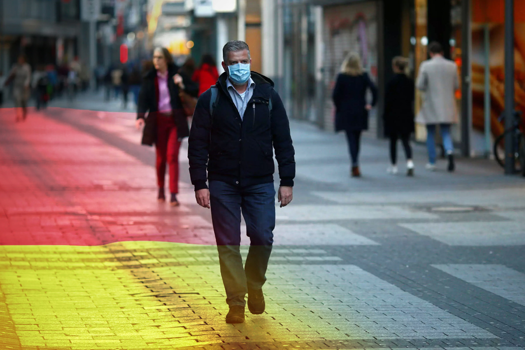 as-coronavirus-spreads-in-germany-so-does-antisemitism Reuters file photo of man walking down street with face mask