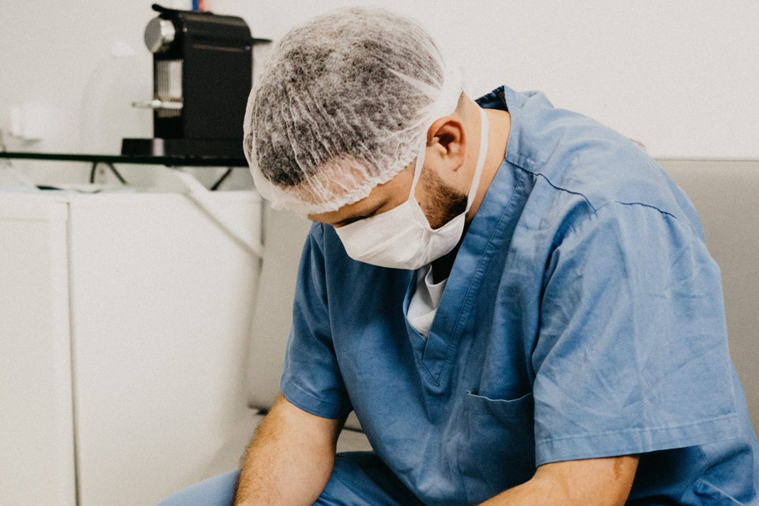 experienced-doctor-we-may-never-be-the-same-after-covid-19-and-thats-ok Doctor sitting. Jonathan Borba on Unsplash