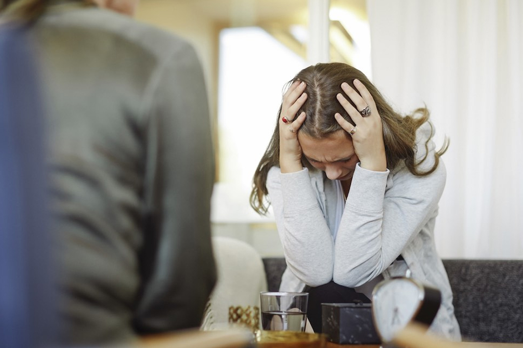 former-planned-parenthood-worker-we-coerced-and-lied-to-women-so-they-would-abort Woman sitting with head in hands