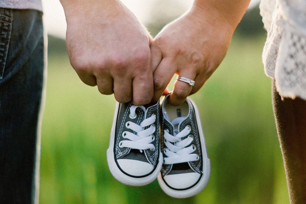 over-207300-abortions-in-the-uk-in-2019-a-record-high Husband and wife holding baby shoes