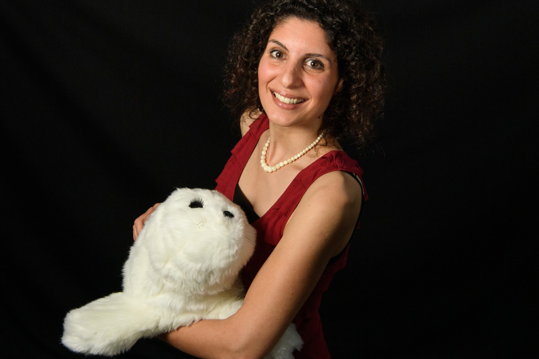 touching-a-furry-robot-reduces-pain-increases-happiness Woman holding Furry robot