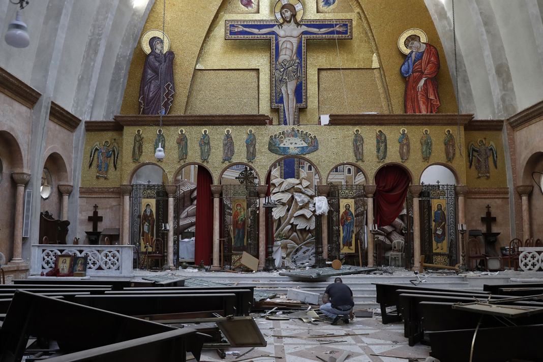 lebanese-christians-suffering-more-misery-after-deadly-beirut-blast A man removes religious icons from the floor of a damaged church (Photo: AP)