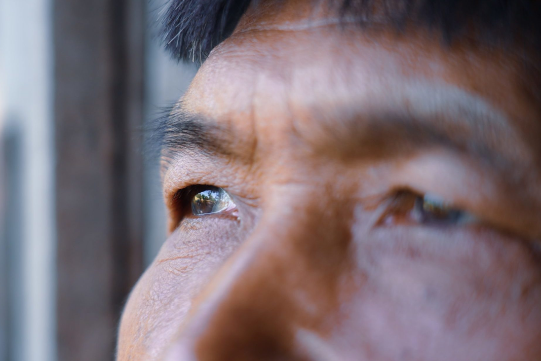 the-cost-of-leaving-ancestral-and-animist-beliefs-to-follow-jesus Person staring out window