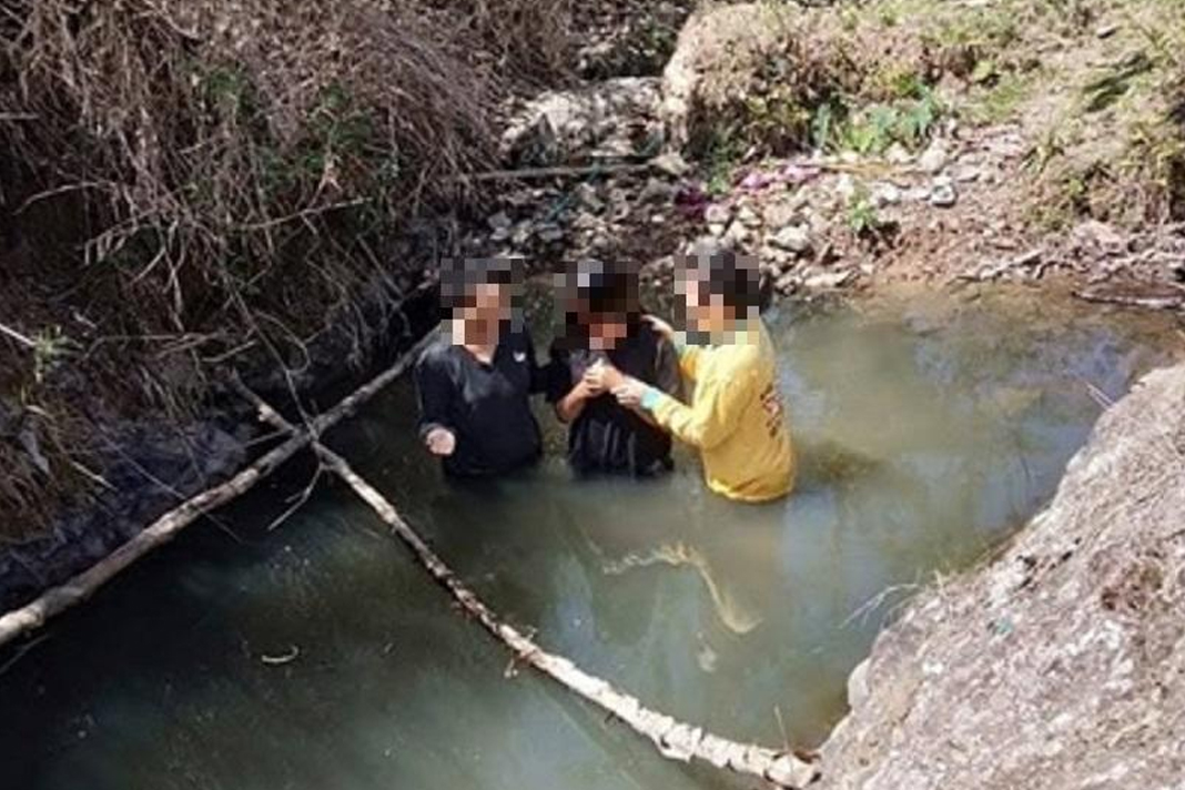 motorbikes-enable-indonesian-evangelists-to-seek-the-lost Person being baptised