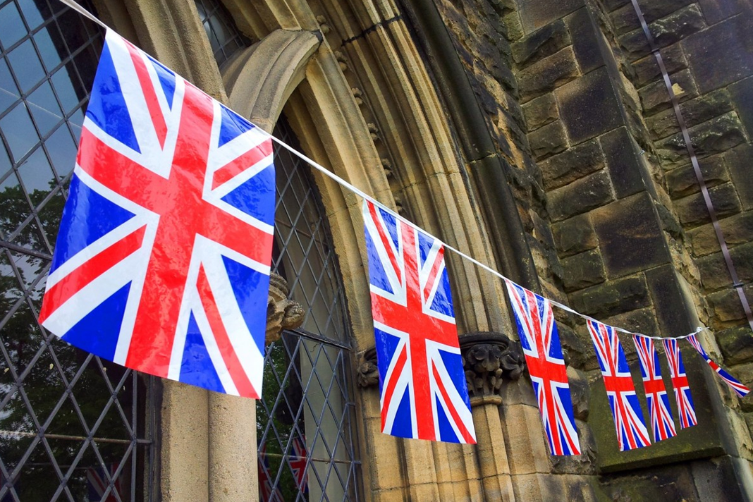 uk-evangelicals-unsettled-as-church-of-england-announces-near-future-decision-on-same-sex-marriage-doctrine UK flags on church