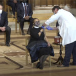 Rev. Patricia Hailes Fears receives the first COVID-19 vaccine at the White House “vaccine confidence event” at the Washington National Cathedral in Washington, D.C.