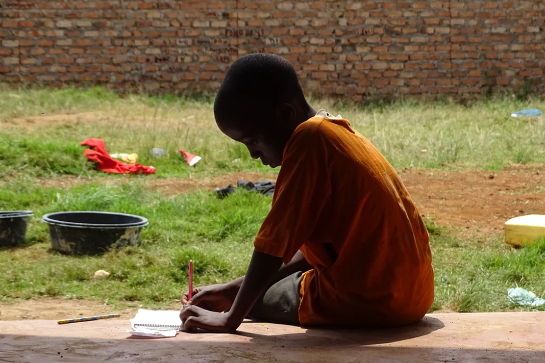 nigeria-kaduna-state-closes-13-mostly-christian-schools-as-abductions-spiral Child sitting on the porch