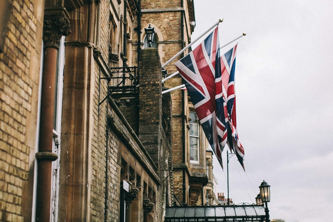 uk-jews-under-assault-highest-number-of-antisemitic-incidents-since-records-began Flags on the side of a building in Oxford, United Kingdom