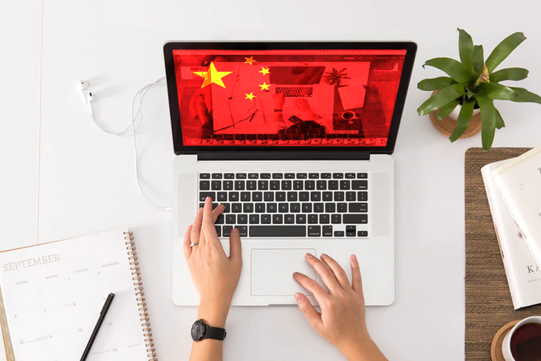 chinese-authorities-interrupt-virtual-church-service laptop with Chinese flag