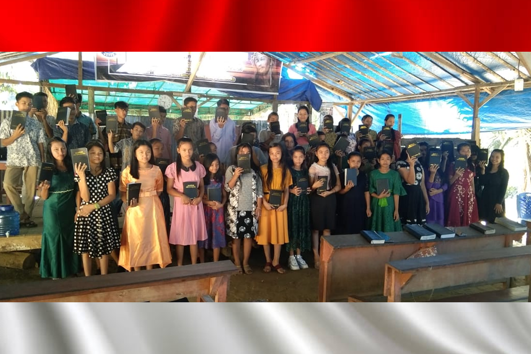 persecuted-churches-in-aceh-receive-bibles-from-icc Youth from GKPPD Sanggaberu in Aceh receive Bibles in their local language.